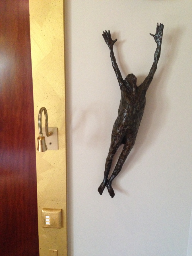 The skinny hanging man sculptures were all over the room and hotel
