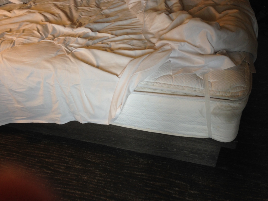 Messy sheets and a droopy mattress pad