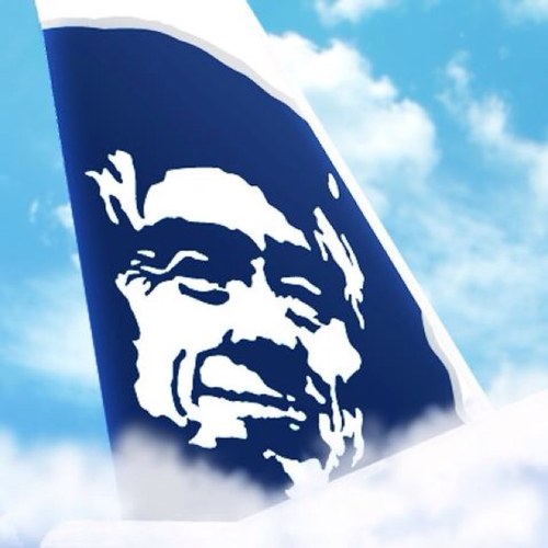 a blue and white flag with a face on it