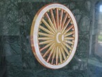 a wheel painted on a green marble surface
