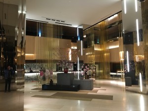 a lobby with gold and silver columns