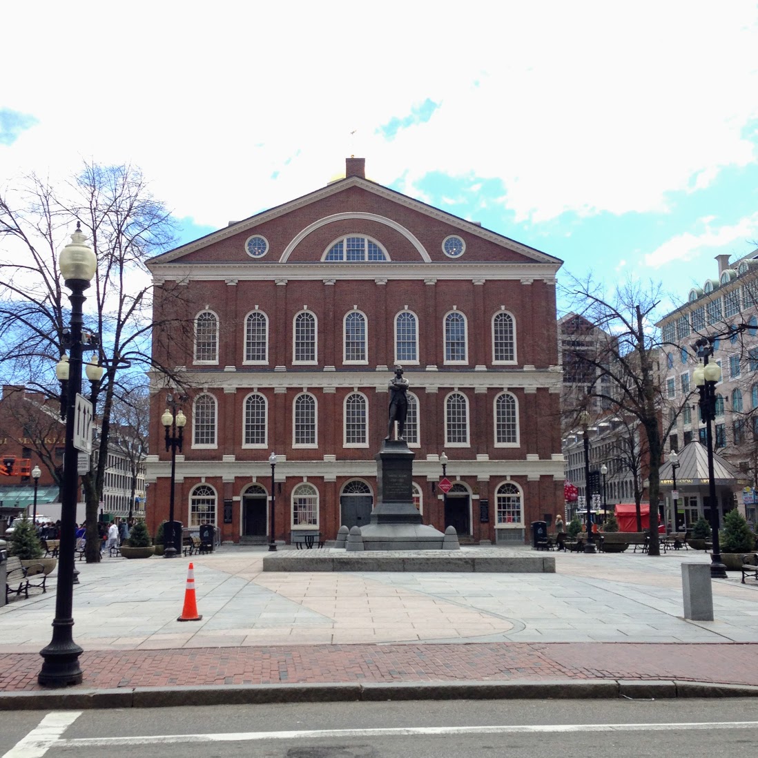 a statue in front of Faneuil Hall