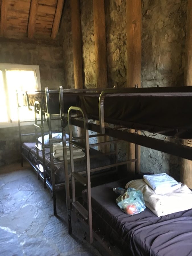 a room with bunk beds and a window