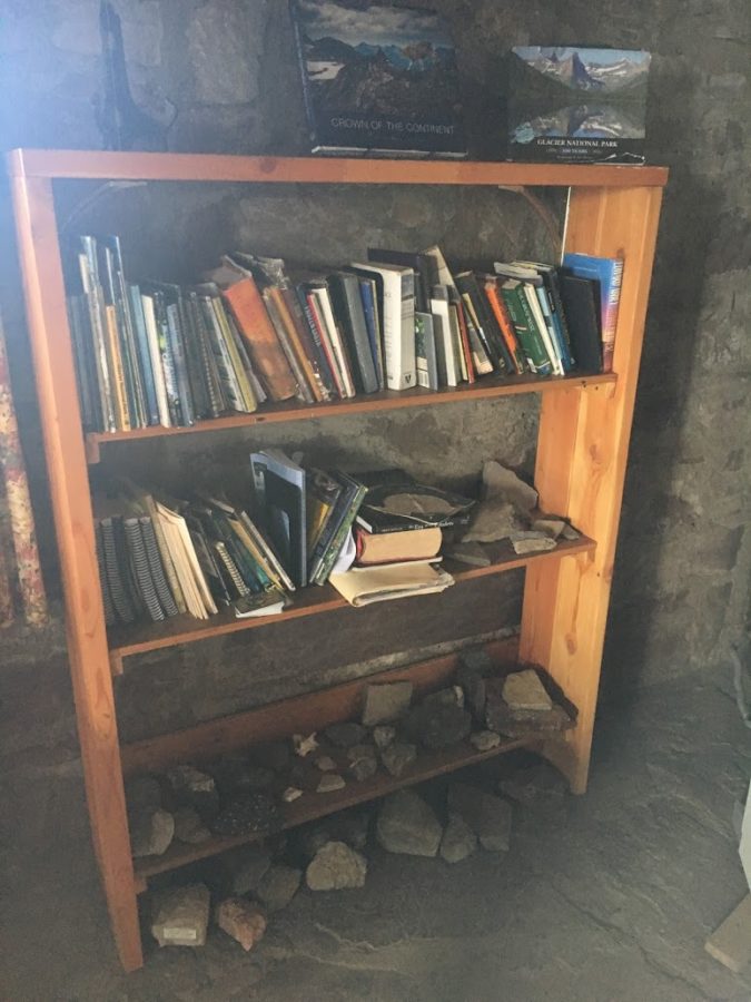 a wooden shelf with books on it
