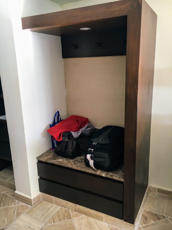 a closet with luggage on it