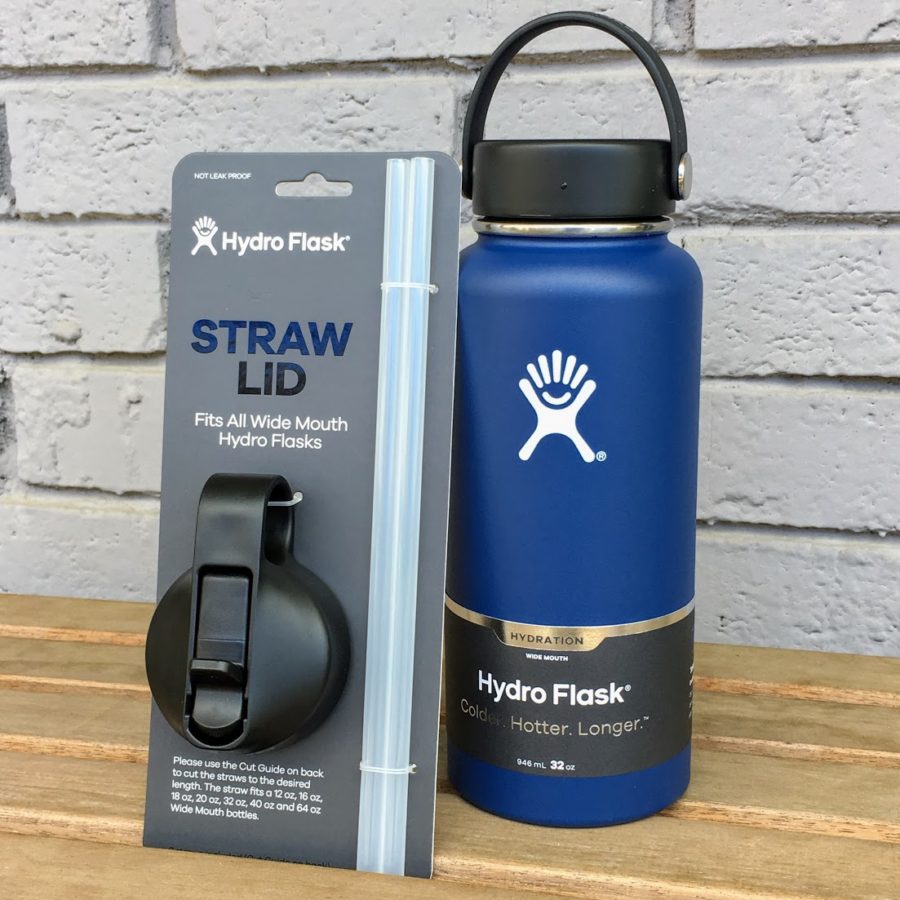 a blue water bottle and a black holder