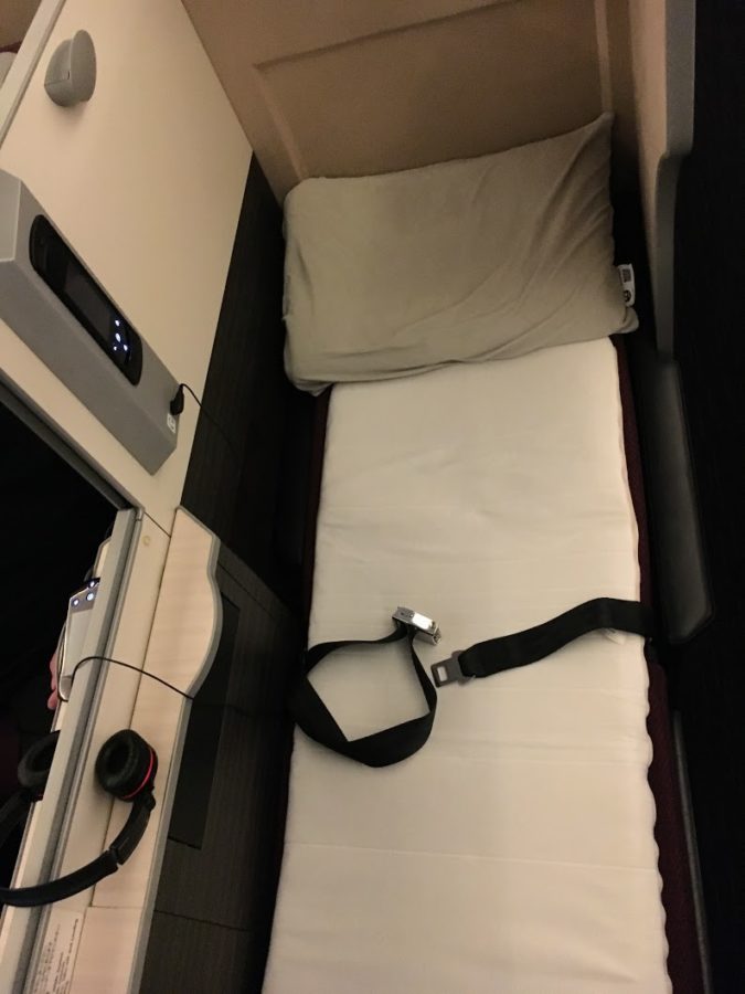 a seat belt on a bed