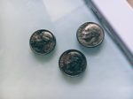 a group of coins on a table