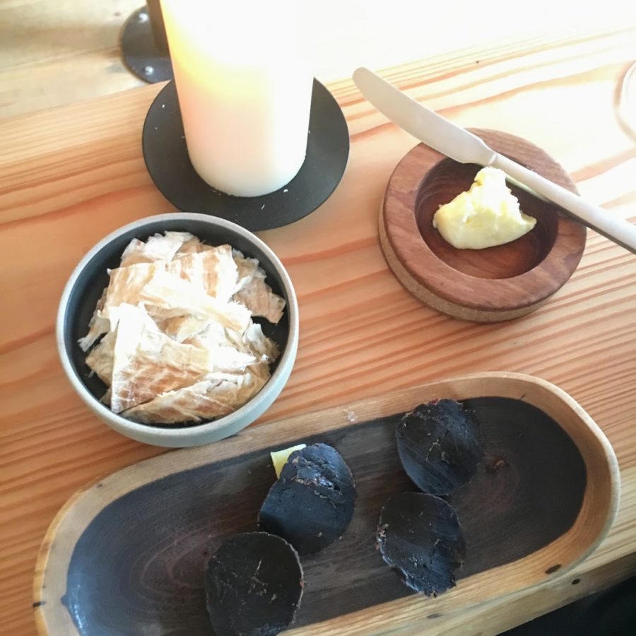 a plate of food and a candle on a table