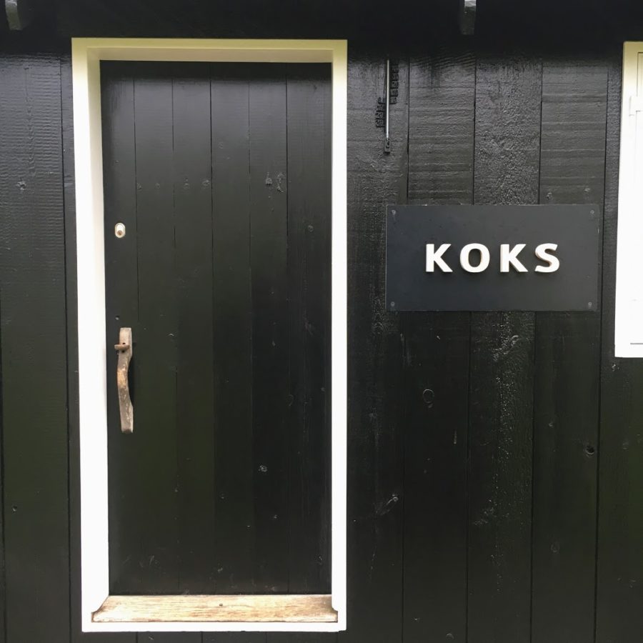 a black door with white text on it