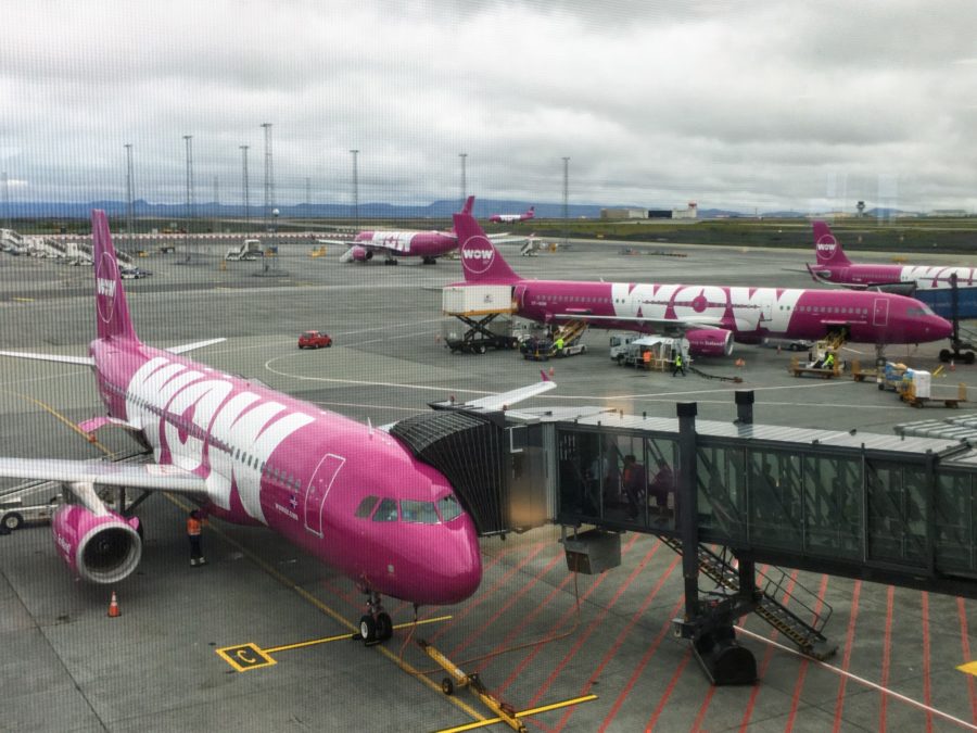 a group of pink airplanes on a tarmac