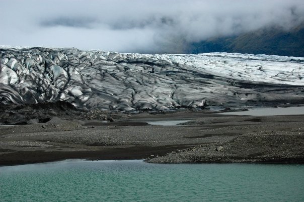 a glacier with a body of water