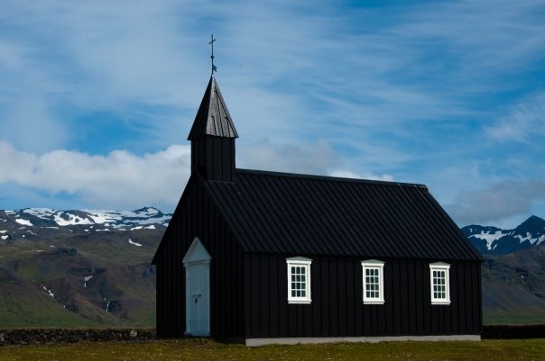 a black church with a steeple