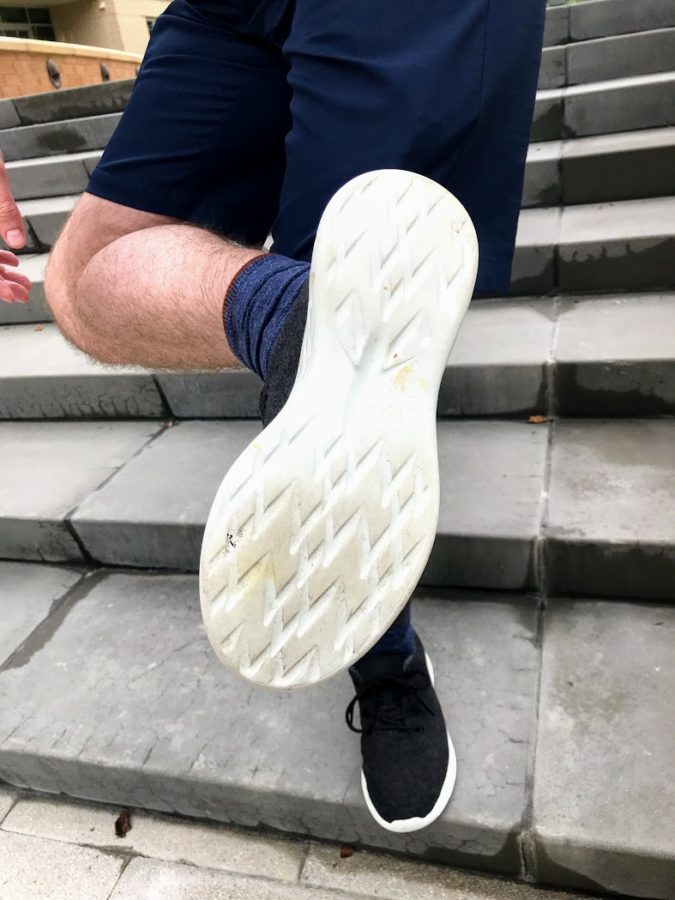 a person's leg and bottom of a shoe