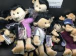a group of stuffed dolls