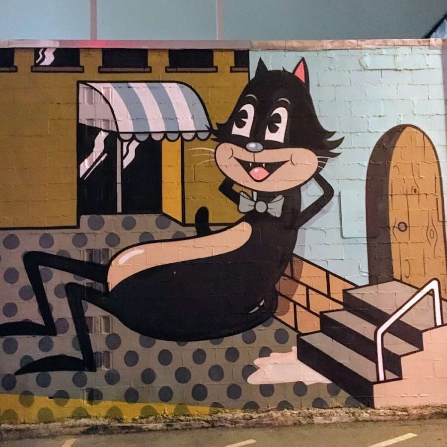 a mural of a cat on a wall