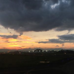 a sunset over a city
