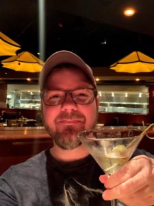 a man holding a martini glass