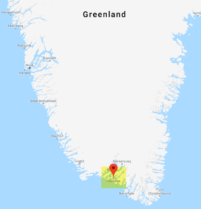 a map of greenland with a red marker on it