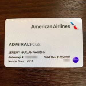 a white card with a blue and red logo on it