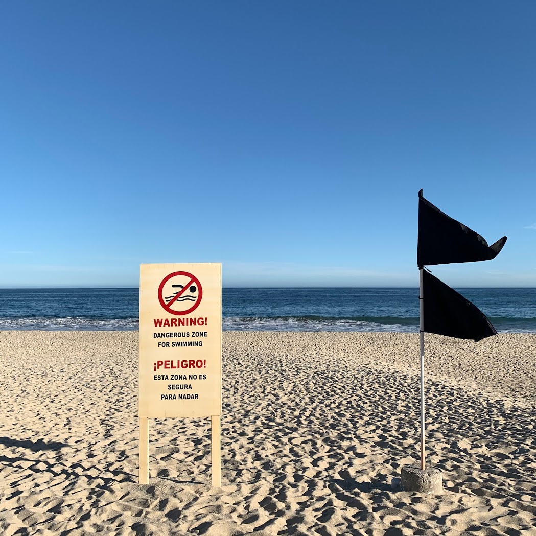 a black flag on a beach