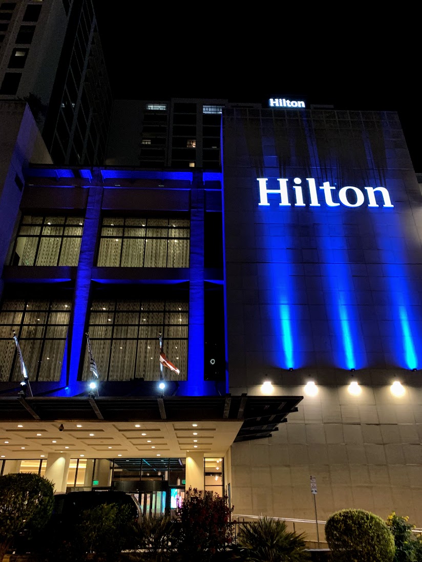 a building with a blue lit up sign
