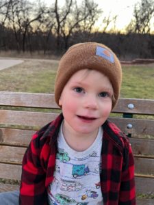 a child sitting on a bench