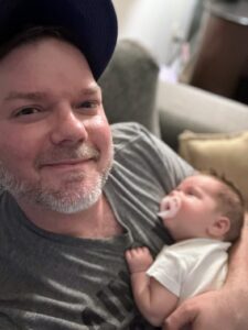 a man holding a baby