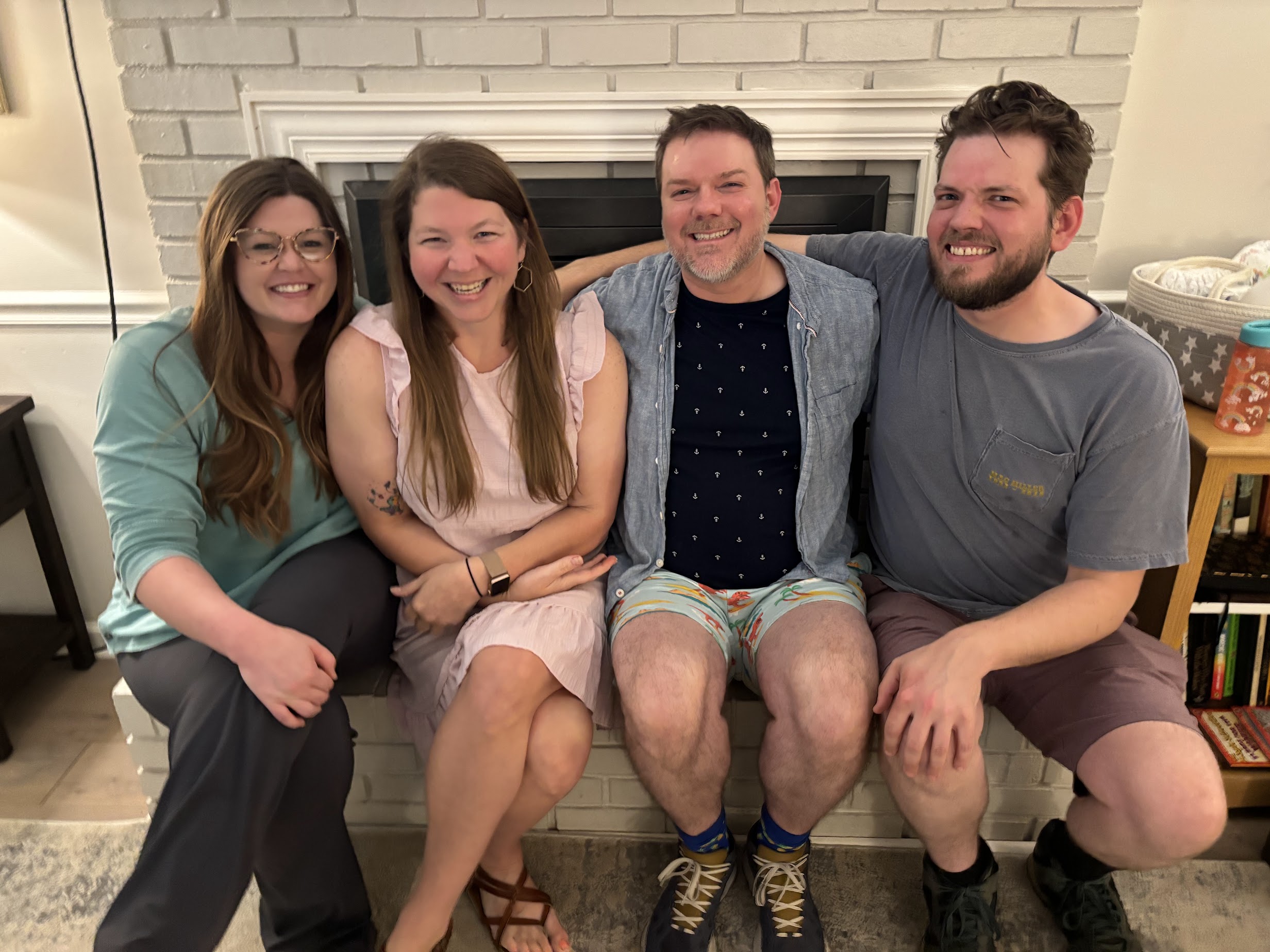 a group of people sitting together smiling