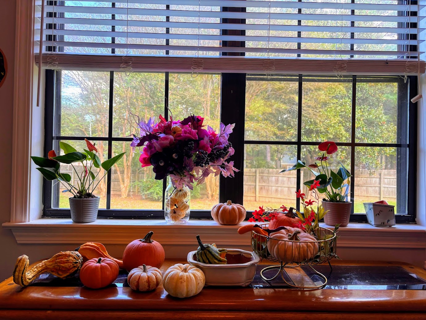 a window with flowers and vegetables