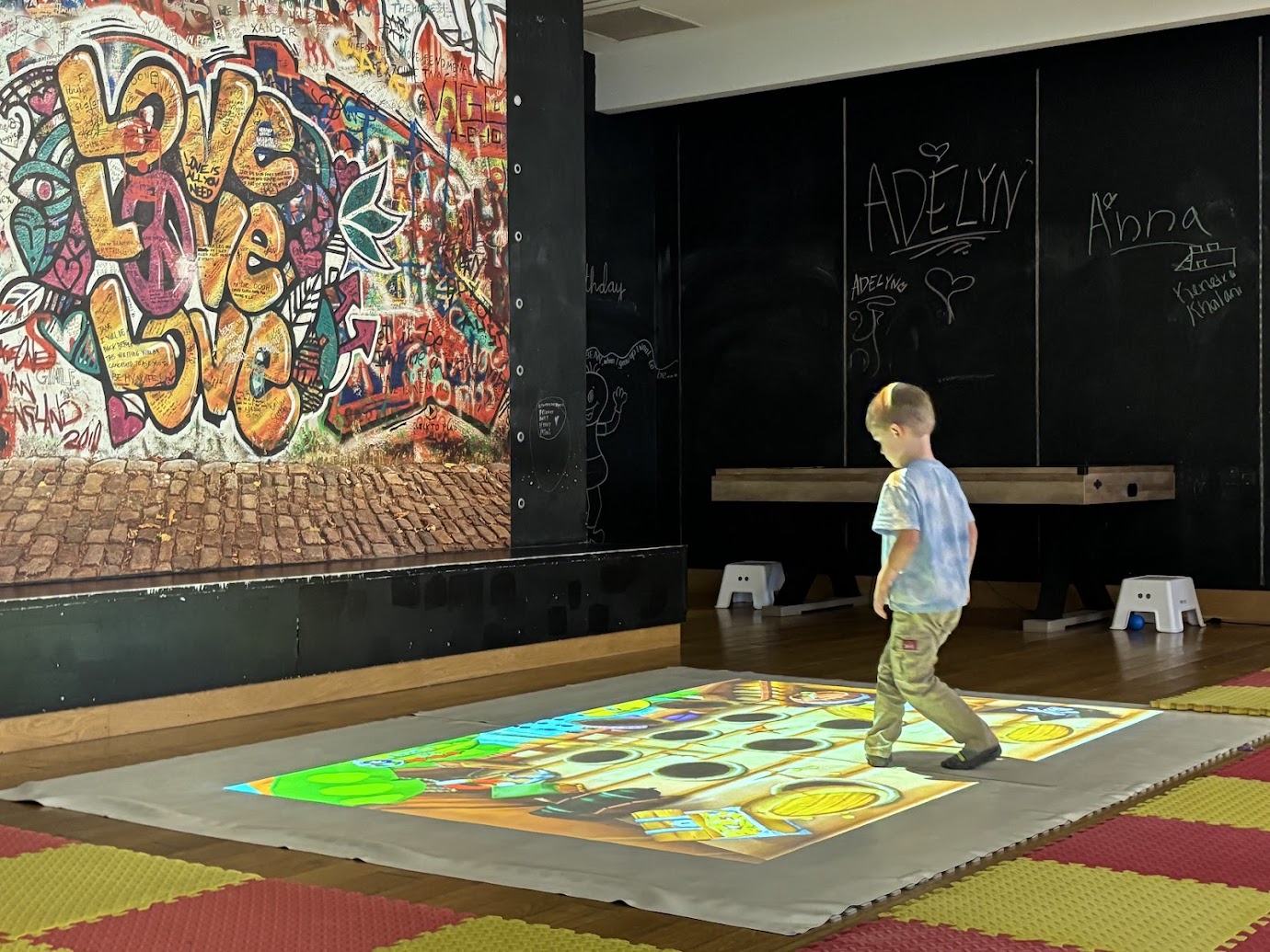 a boy walking on a carpet