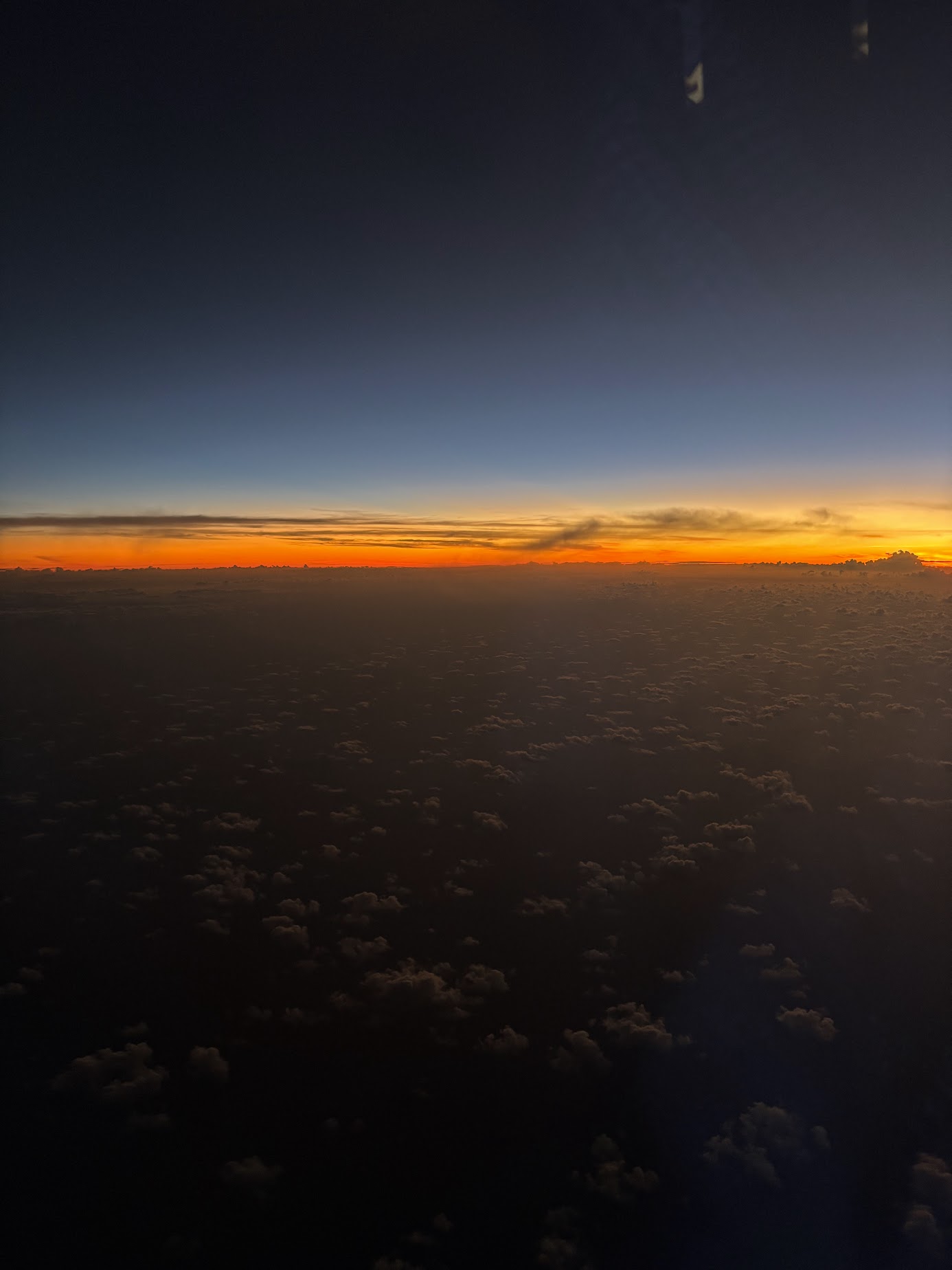 a sunset over clouds