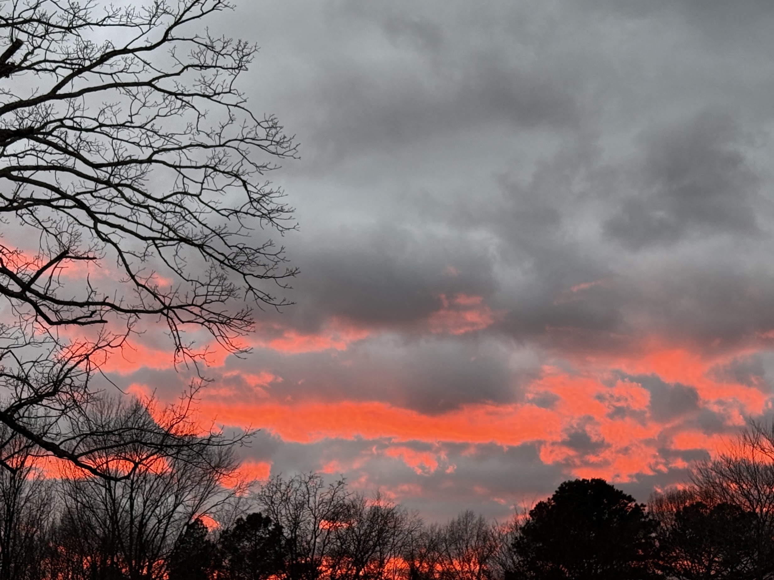 a sunset with clouds in the sky