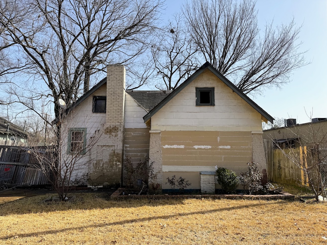 a house with a fence and a yard